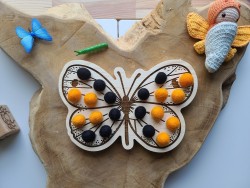 Papillon à encoches